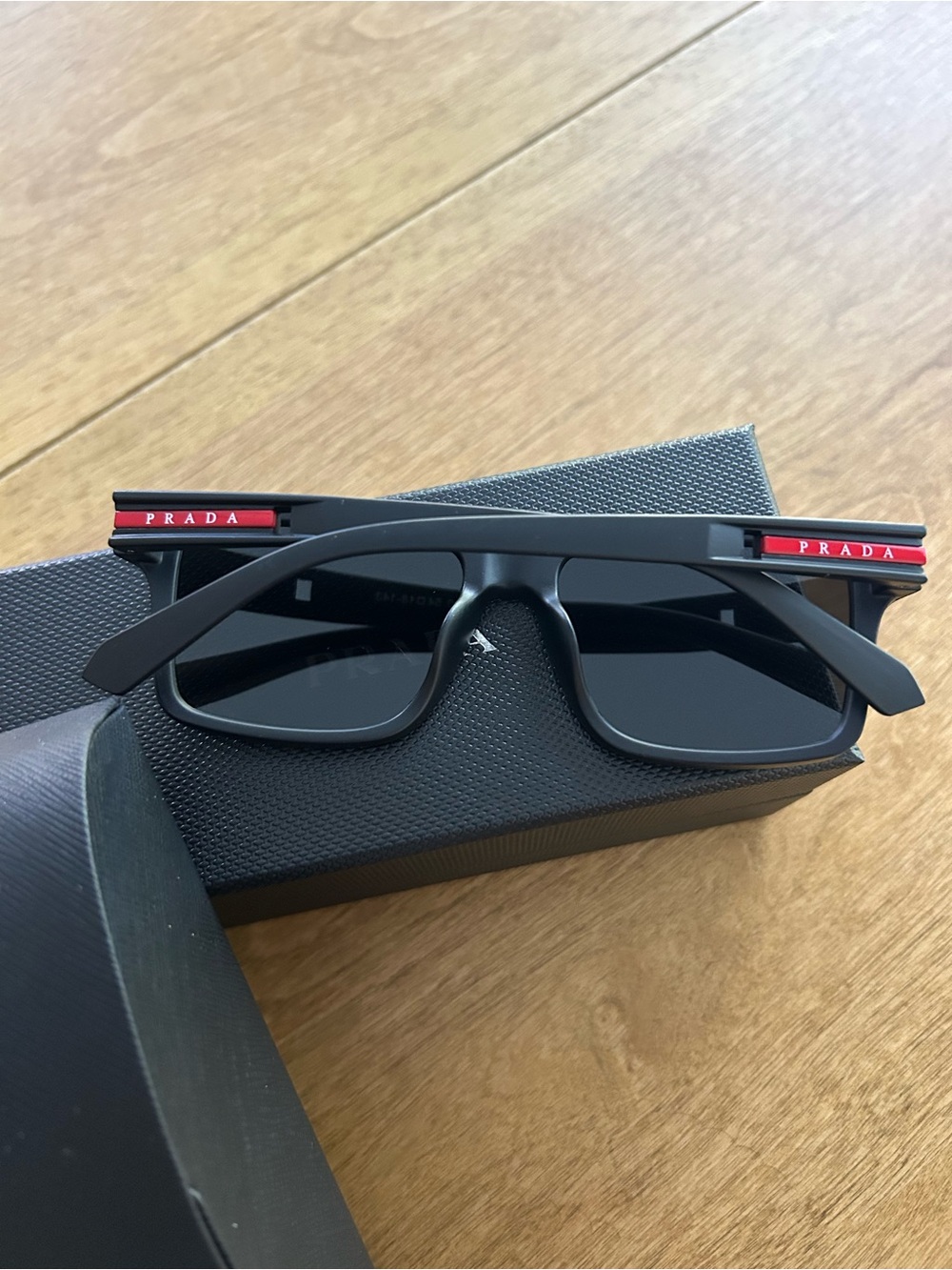 Prada Black Square Sunglasses with Subtle Red Accent - Picture 3 of 4